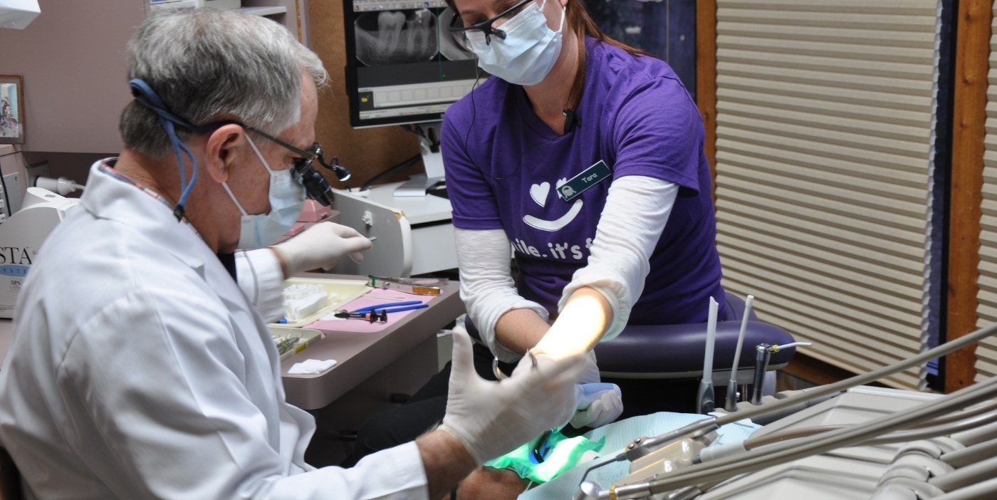 Two San Marcos dentists treating a patient