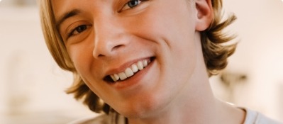Close up of young blond man smiling